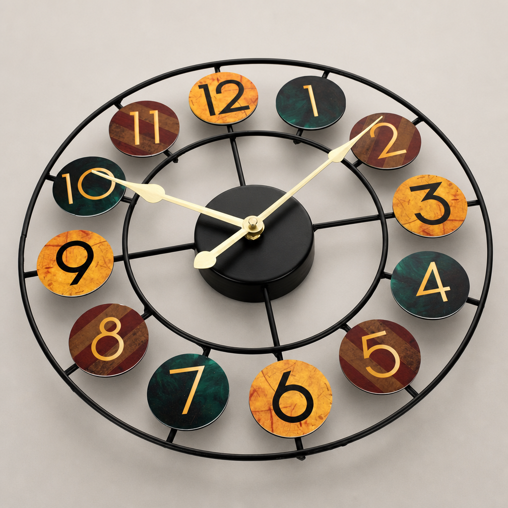 Round open-frame wall clock with multicolor numbered discs and gold hands.