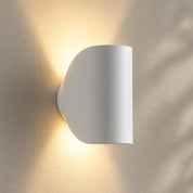 White curved wall light with up-and-down lighting