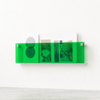 Translucent green wall-mounted magazine rack holding books and postcards.