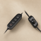 Two black inline cord switches, one with timer buttons and one dimmer switch, on a warm beige background.