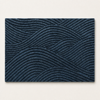 Dark blue rectangular rug with raised geometric wavy line texture on a light background.