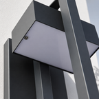 Gray and black angular outdoor wall light with a frosted rectangular panel and visible screw.
