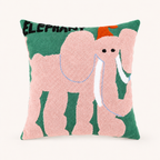 Pink elephant pillow with green background and no side tag.