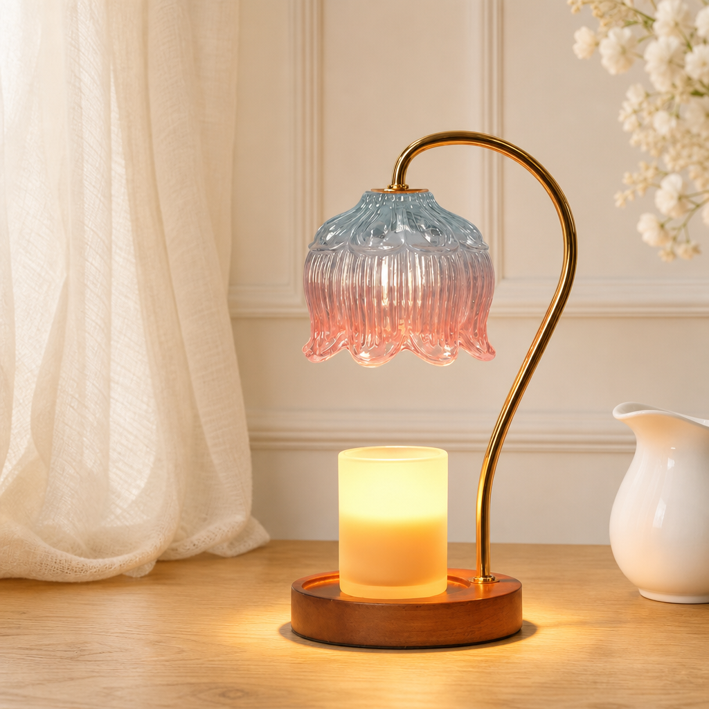 Ribbed glass candle warmer lamp with gold arched stand, wooden base, and glowing yellow candle.