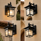 Black outdoor wall lantern with glass panels mounted on a beige stucco wall.