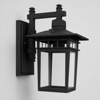 Black outdoor wall lantern sconce with clear glass panels on a plain light background.