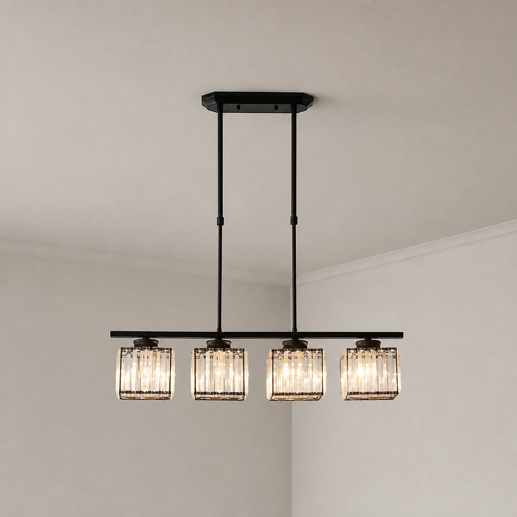 Black four-light linear pendant with glowing ribbed glass shades on a pale corner ceiling.