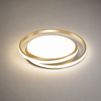 Gold circular LED ceiling light glowing on a neutral surface.