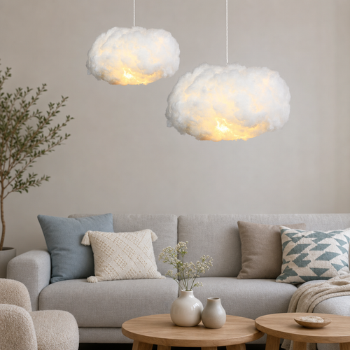 Two glowing cloud pendant lights hang above a light gray sofa in a cozy living room.