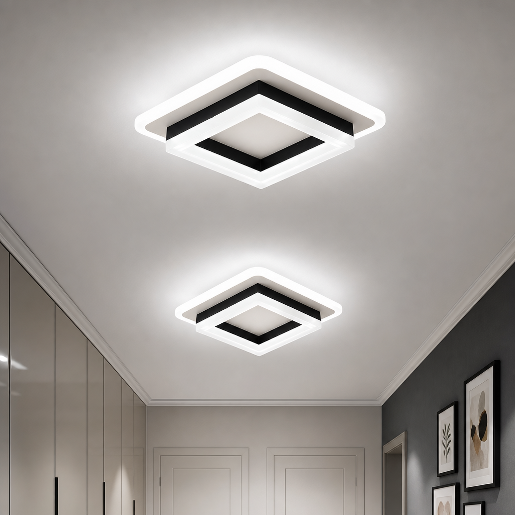Two glowing square ceiling lights with white frames and black trim in a modern hallway.