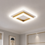 Square white and gold LED ceiling light fixture glowing in a modern room.