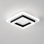 Square black and white ceiling light with a glowing white rim on a plain gray ceiling.