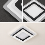 Square white and black acrylic ceiling light fixture with layered diffuser panels.