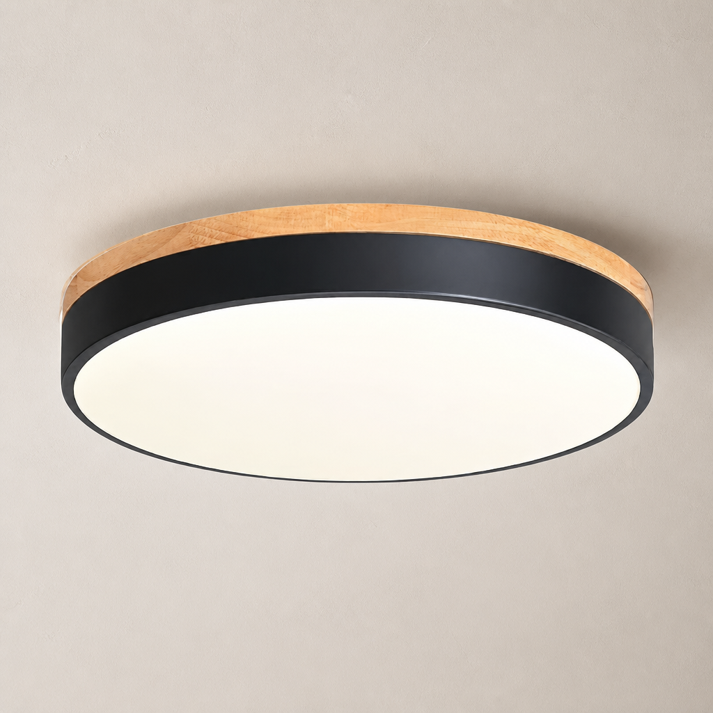 Round ceiling light with wood trim, black band, and glowing white diffuser.