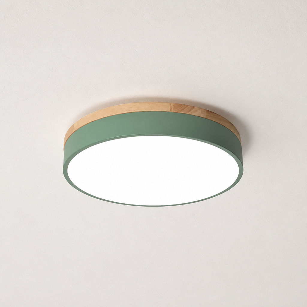 Round ceiling light with wood trim, sage green side band, and glowing white diffuser.