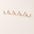 Rose gold wavy wall rack with multiple rounded hooks on a clean white surface.