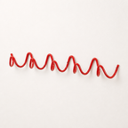 Red wavy wall-mounted coat rack on a clean white wall.