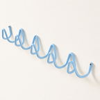 Light blue wavy wall-mounted hook rail on a plain white wall.