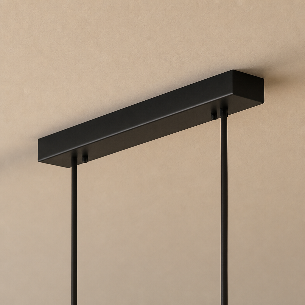 Black rectangular ceiling light canopy with two slim hanging rods on a warm beige ceiling.