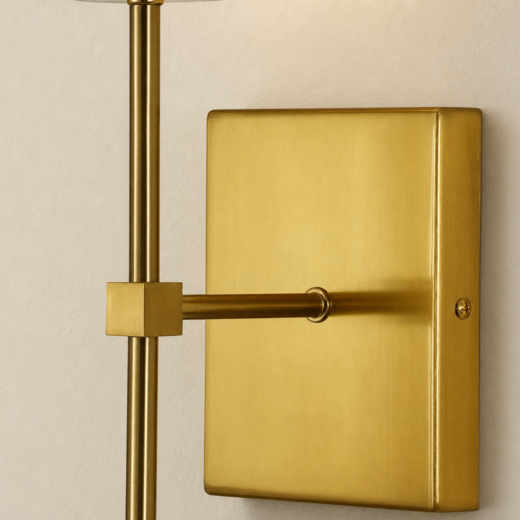 Brushed brass wall sconce bracket with a rectangular backplate, horizontal arm, and vertical rod.