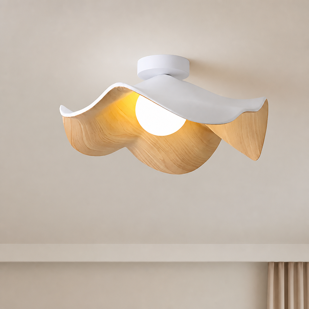 Wavy white and wood ceiling light with a glowing round bulb mounted on a neutral ceiling.