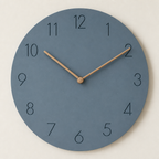 Round blue-gray wall clock with black numerals and wooden hands.