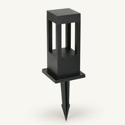 Black square garden stake light with open window panels and pointed ground spike.