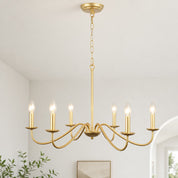 Gold six-light chandelier with candle bulbs suspended from a chain in a bright modern room.