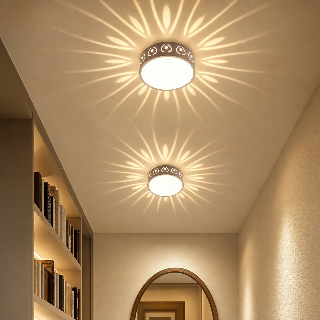 Two round ceiling lights cast floral light patterns in a warm hallway.