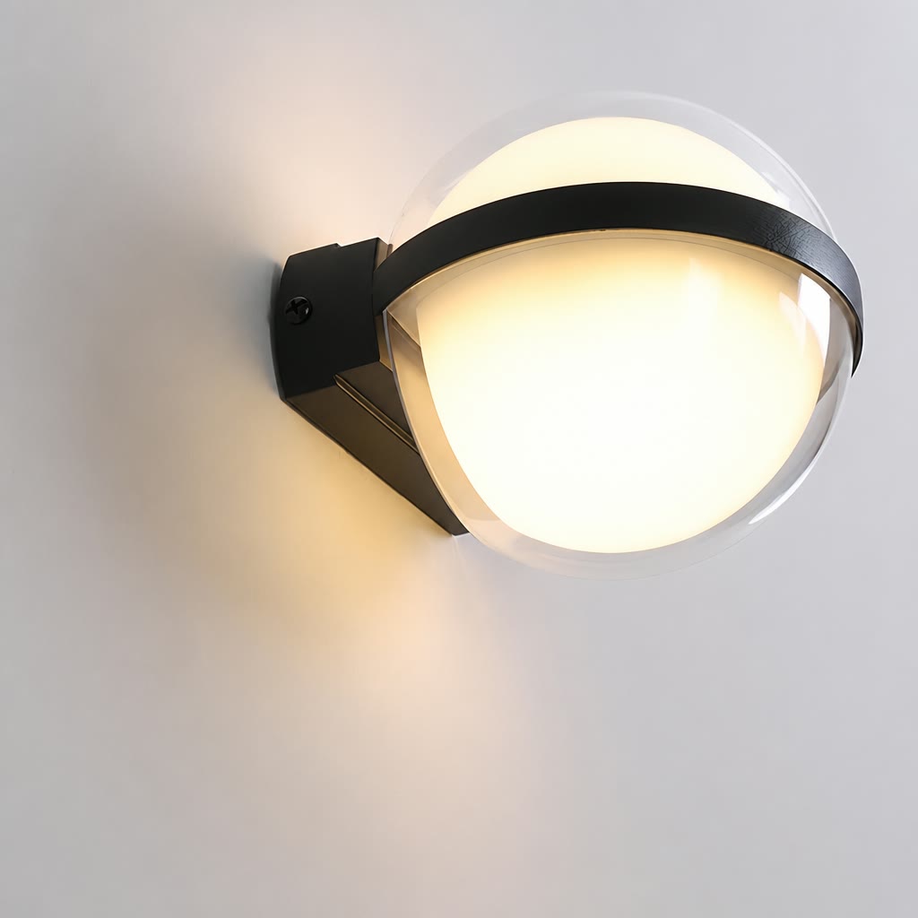 Glowing round wall light with black mounting bracket on a pale wall.