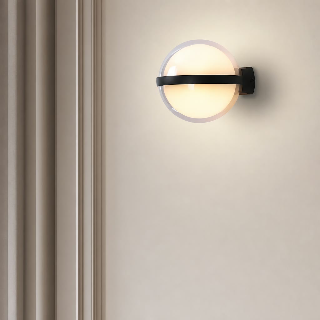 Glowing round wall sconce with a black horizontal band on a pale wall.
