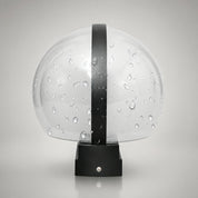Transparent water-dotted dome with a black vertical strap and base.