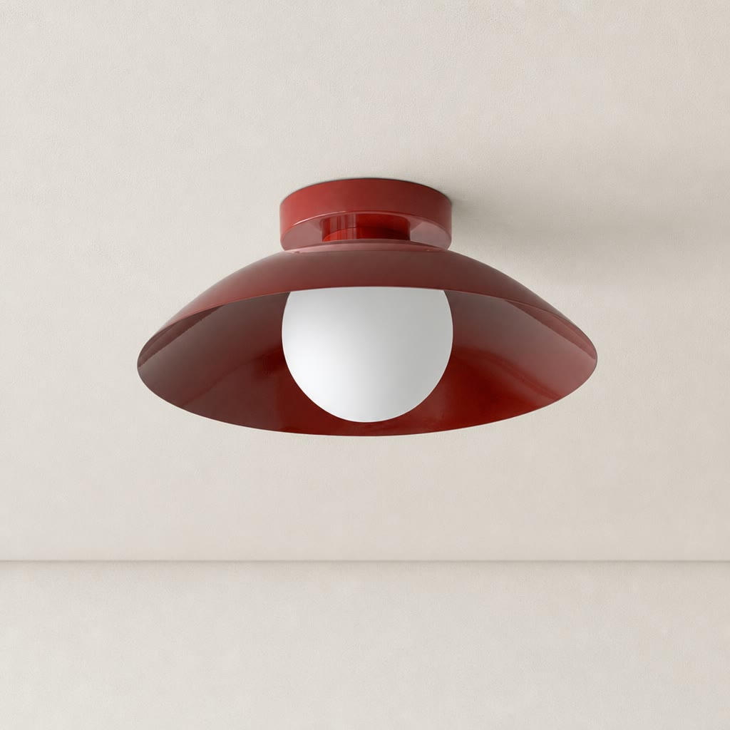 Glossy dark red ceiling light with a wide curved shade and white globe bulb.