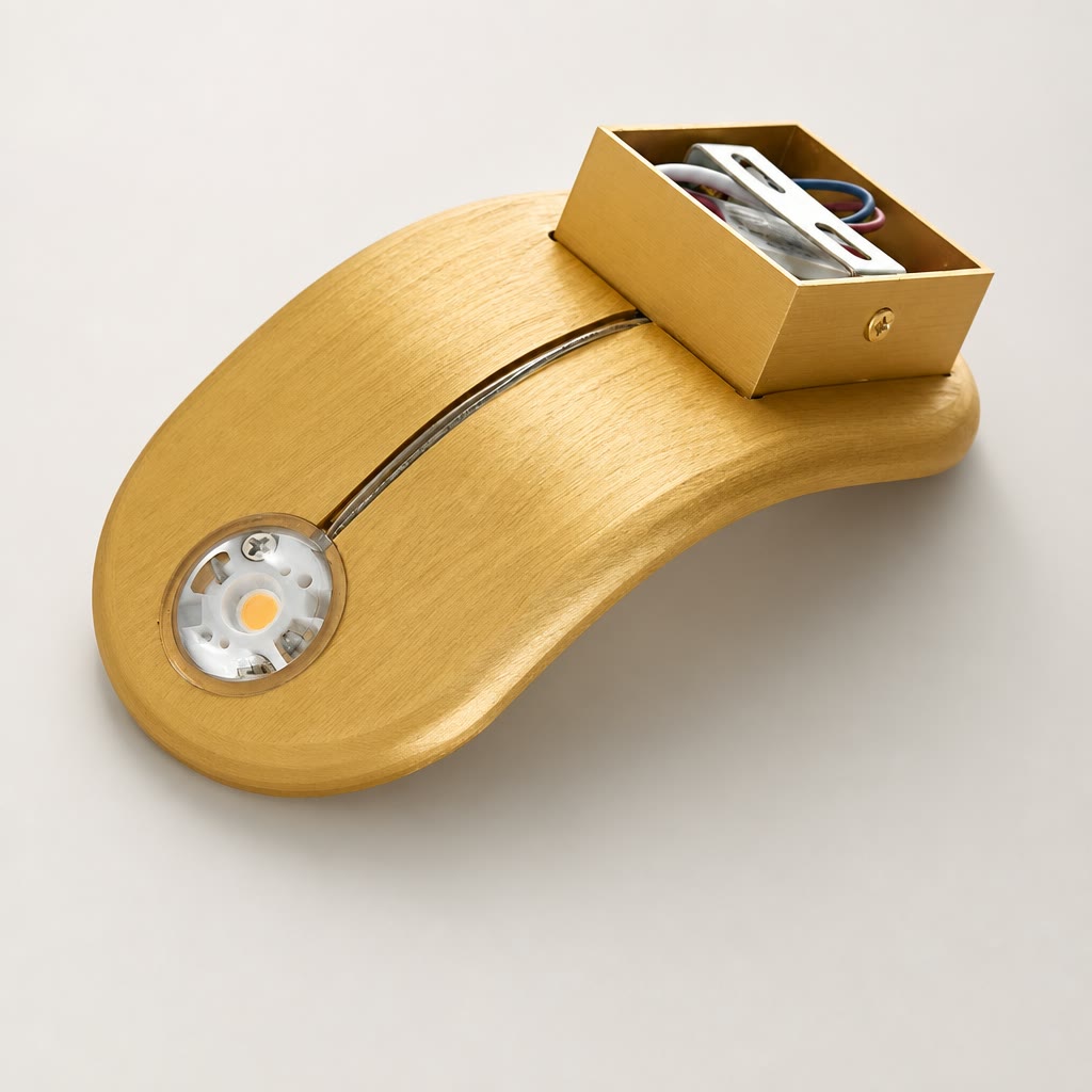 Brushed gold curved light fixture with a circular LED and open wiring compartment.