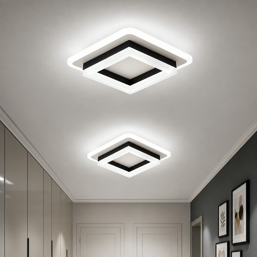 Two glowing square ceiling lights with white frames and black trim in a modern hallway.