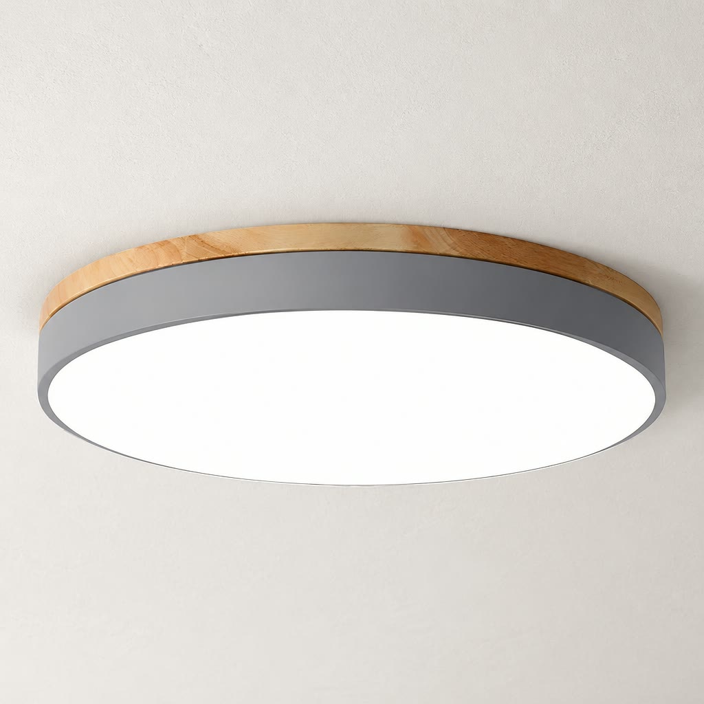Round ceiling light with gray side band, wood trim, and bright white diffuser.