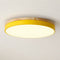 Round yellow ceiling light with wood trim and glowing white diffuser.