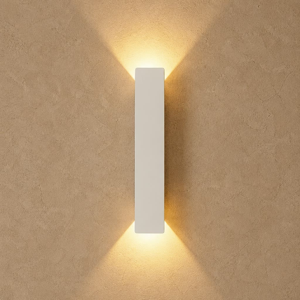 White rectangular wall light casting warm beams on a textured beige wall.