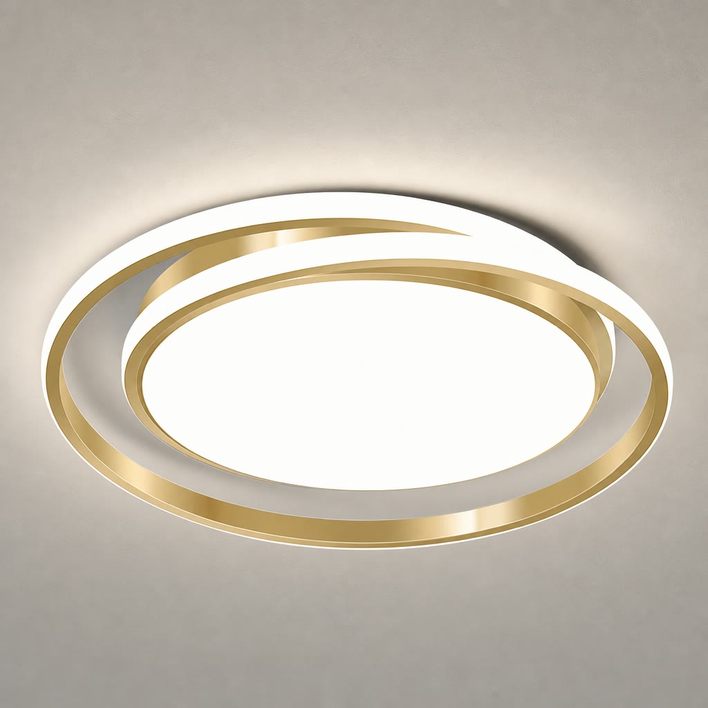 Gold and white circular LED ceiling light with a glowing center on a gray ceiling.