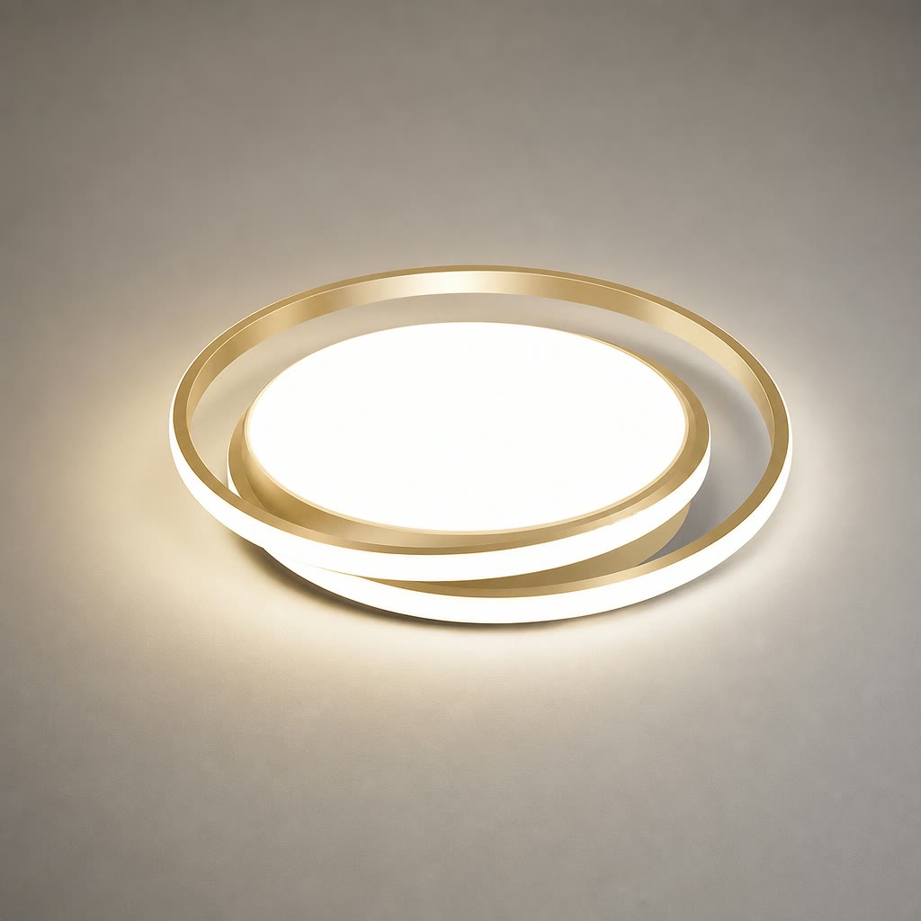Gold circular LED ceiling light glowing on a neutral surface.