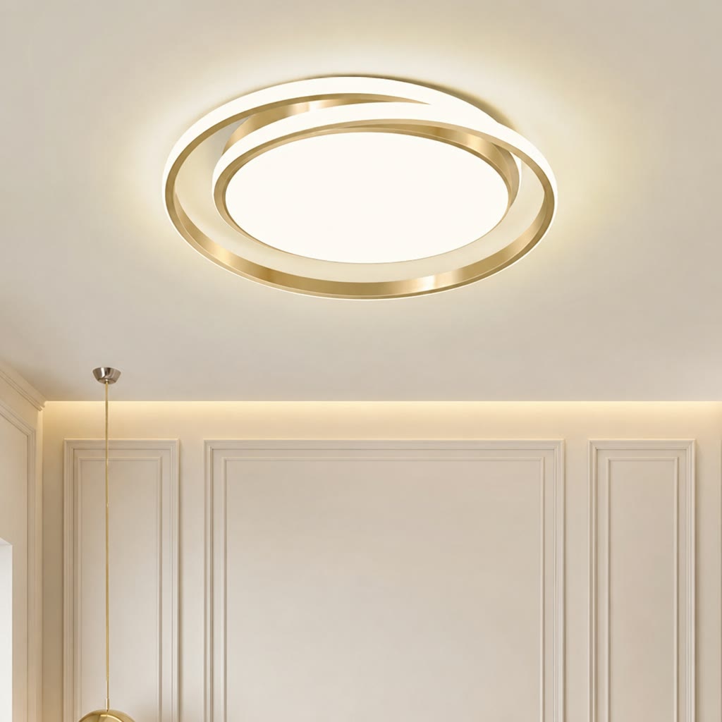 Gold circular LED ceiling light glowing on a paneled cream ceiling and wall.