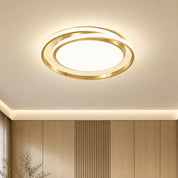 Gold circular ceiling light with glowing rings mounted on a warm modern ceiling.