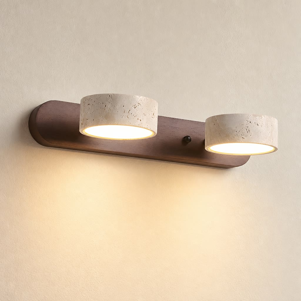 Two warm glowing cylinder lights on a wooden wall-mounted fixture.
