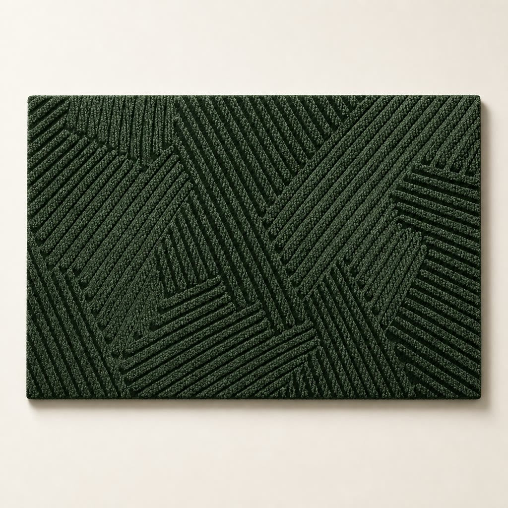 Dark green rectangular textured rug with raised geometric line pattern on a plain light background.