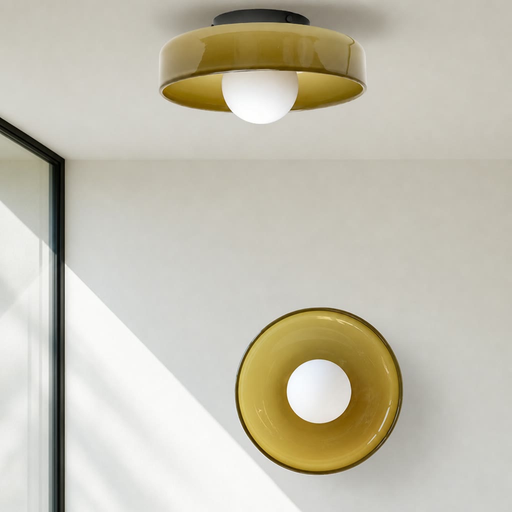 Two glossy amber ceiling lights with round white bulbs in a minimalist interior.