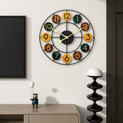 Colorful round wall clock with black metal frame and numbered wooden discs.