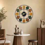 Colorful round wall clock with black metal frame and numbered wooden discs.