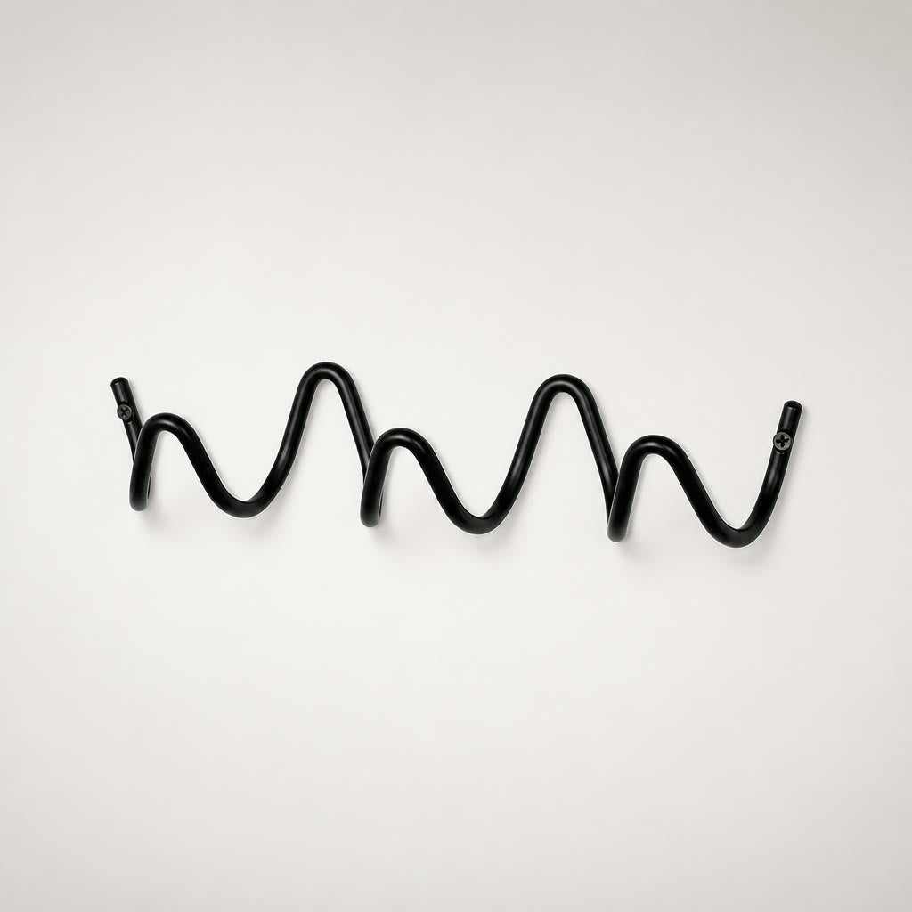 Black wavy metal wall hook rack with screw mounts on a clean white background.