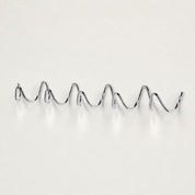 Chrome wavy wall-mounted multi-hook rack on a clean light background.