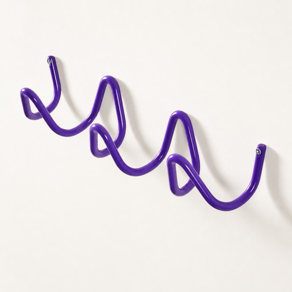Purple wavy wall-mounted metal rack with visible end screws on a plain light wall.